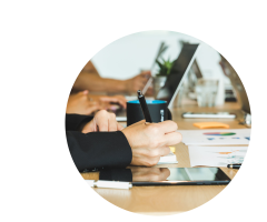 woman-taking-notes-during-team-meeting